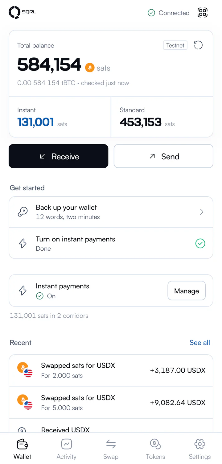 Wallet home: a total balance in sats, split into instant and standard, with receive and send buttons